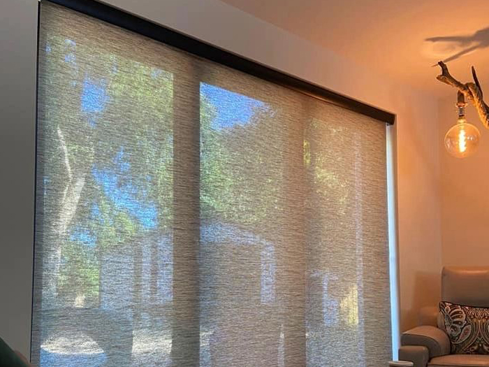 image of a deluxe roller blind with beige semi transparent fabric