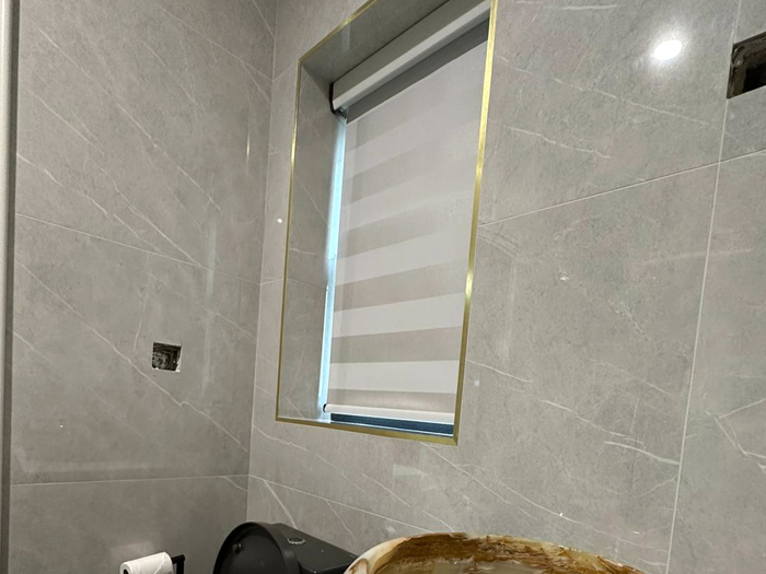 modern roller blind with fascia in newly renovated bathroom