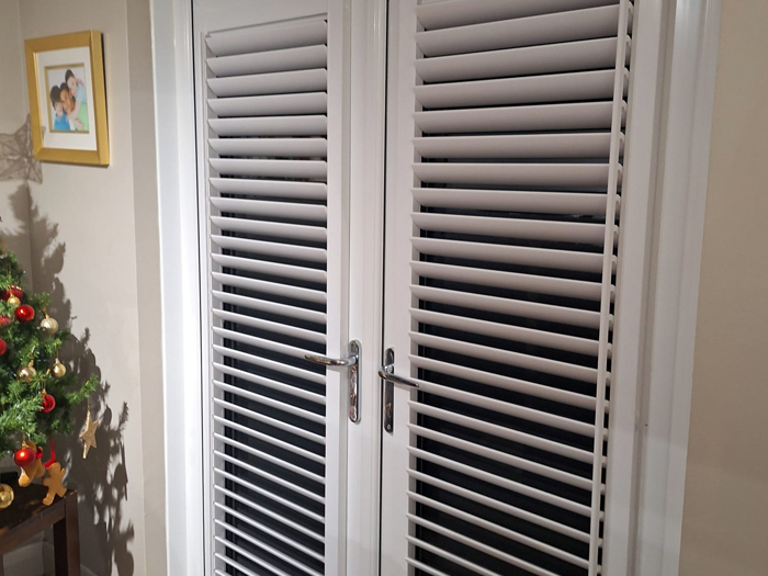 perfect fit shutters in white on a set of patio doors