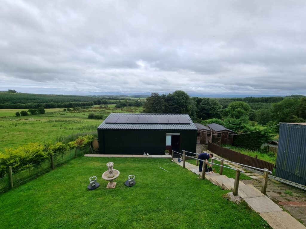 solar panel installation on modern metal shed roof