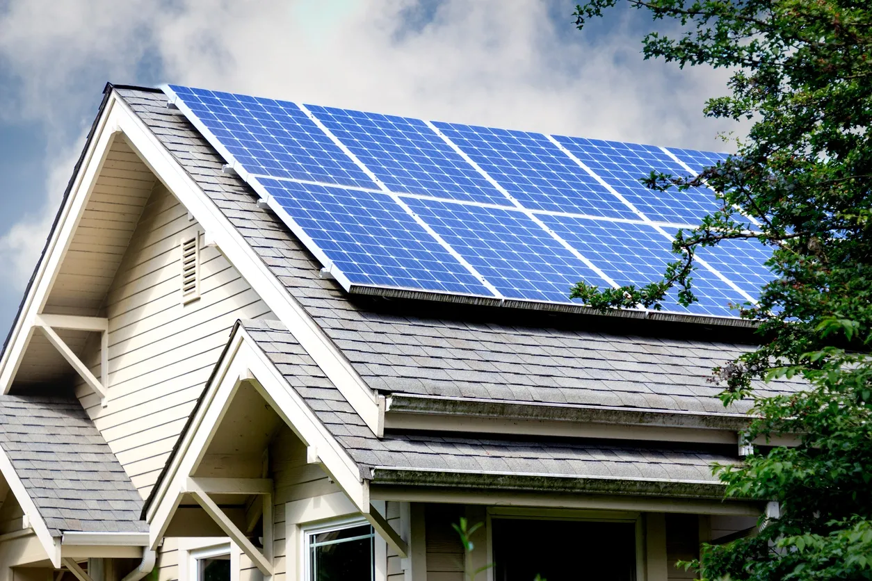 black and silver solar panels on house roof