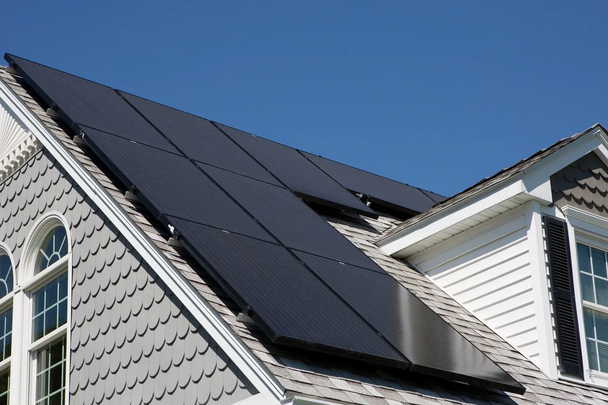black solar panels on house roof