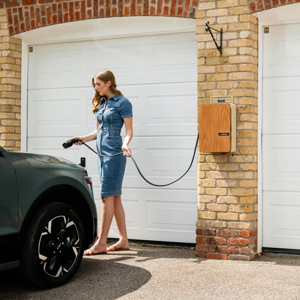 custom ev charger concealed in box with lady holding charger handle