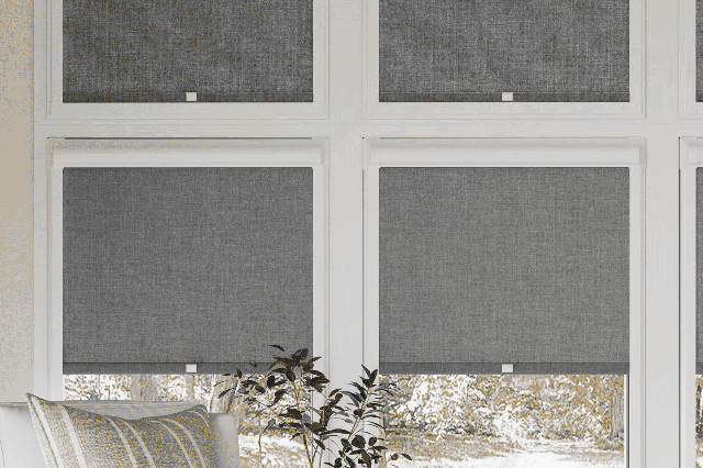 lifestyle image of 4 perfect fit roller blinds in grey