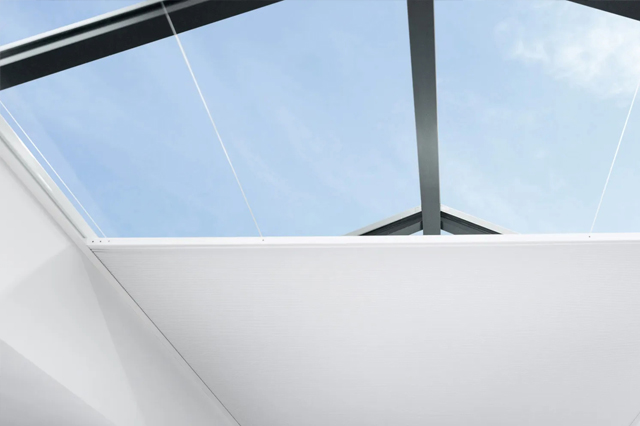 motorised lantern blind semi open with blue sky