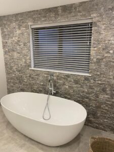 Bathroom Venetian Blind on a grey stone wall
